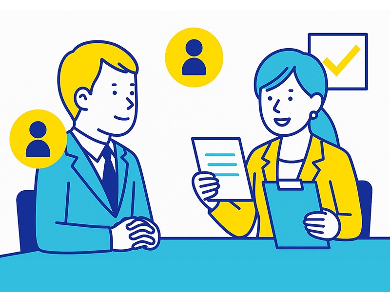 転職の一次面接で人柄や印象を確認する場面を描いたイラスト。スーツ姿の男女が会話する姿を青と黄色のフラットデザインで表現。